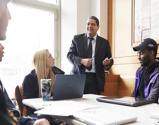 family smiling at the camera