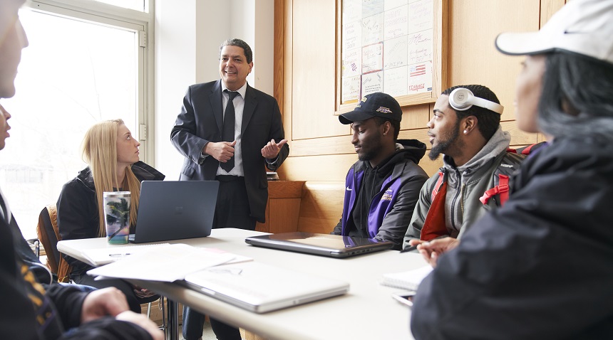 A photo of a professor teaching students in a classroom