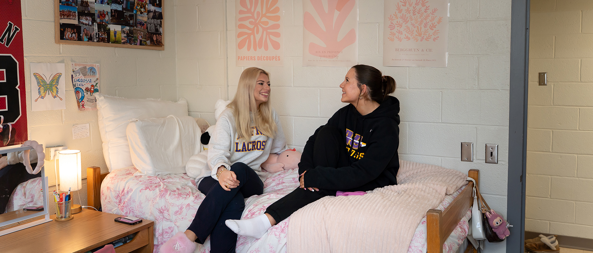 Two Alfred University students in a dorm room