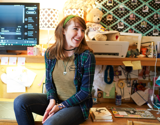 Three Alfred University students in a residence hall room