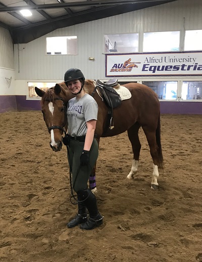 Jessica TenBrink with a horse at the Equestrian Center
