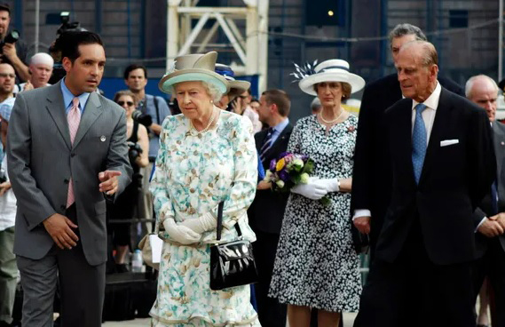 Glen Guzi escorts Queen Elizabeth, Prince Philip to the World Trade Center Memorial