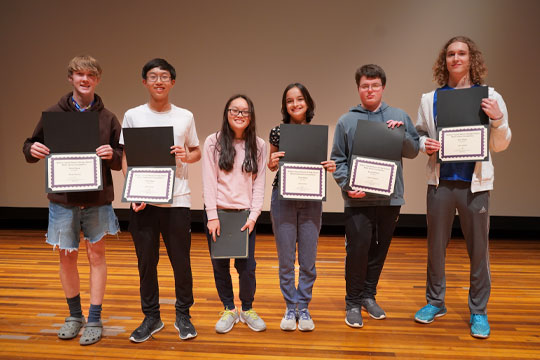 group of six students holding certificates