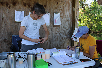 Environmental Studies Technician Nicole Munkwitz and English Professor Julianna Gray working at the Nancy and Frederick Emerson Bird Banding Station