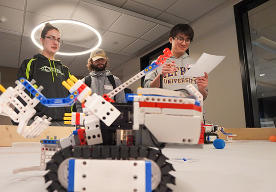 image of students with robots