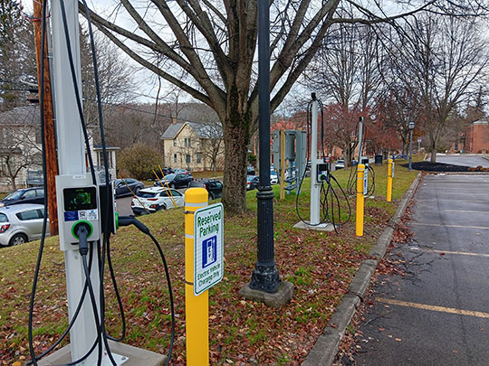 three electric vehicle charging stations