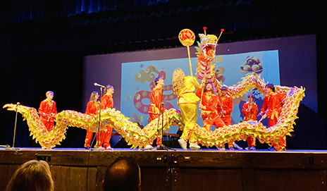image of students dancing dragon dance