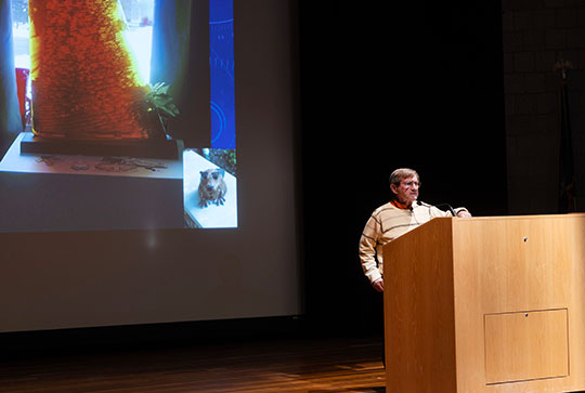 man standing at podium