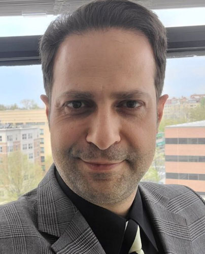 man in suit and tie, smiling