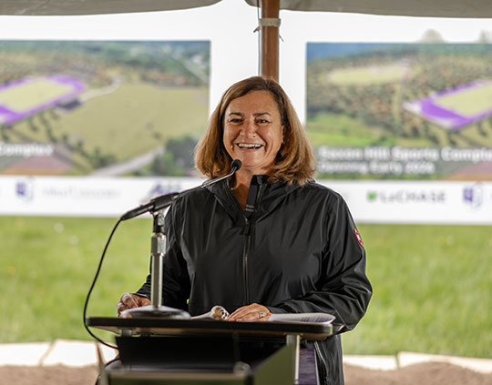 woman speaking at a podium