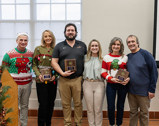 photo of six people standing in a row