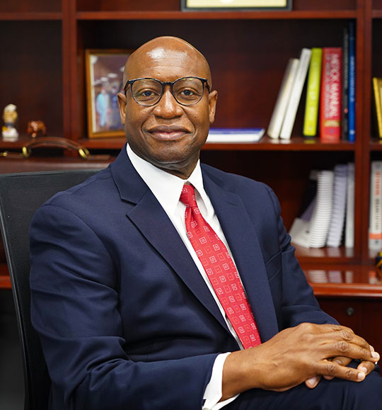 man with suit and tie, sitting