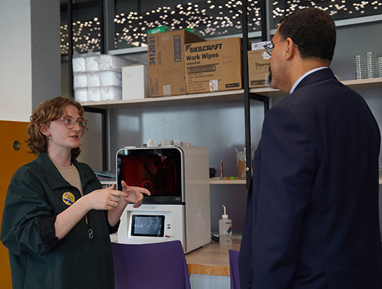woman talking with man in suit and tie