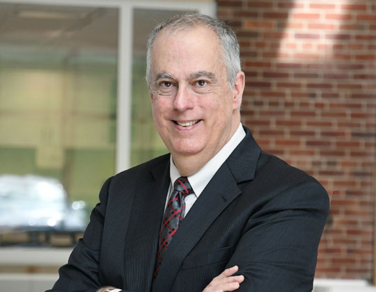 man with coat and tie