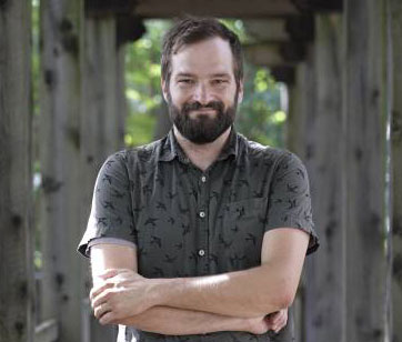 photo of man with beard and dress shirt