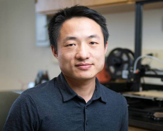 headshot of man in dress shirt
