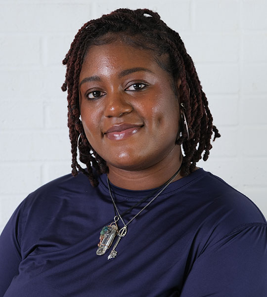 headshot of woman wearing dark tshirt