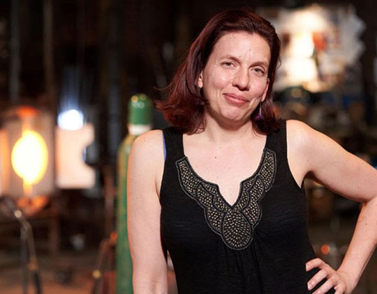 woman with dark hair and black top