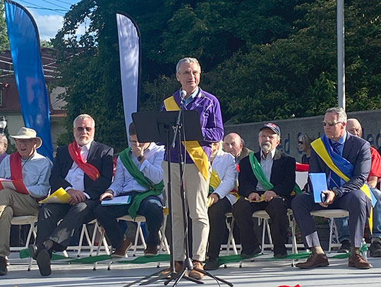 man speaking on a stage