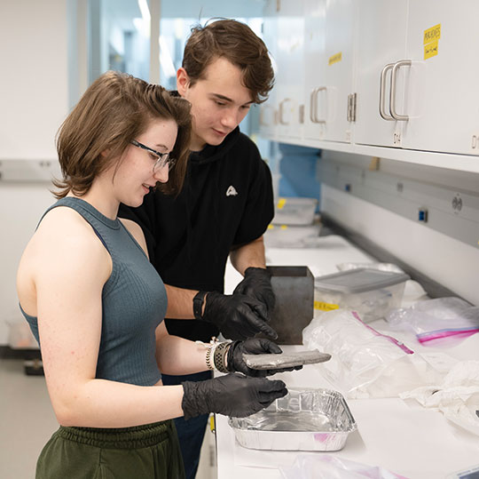 young man and woman in lab