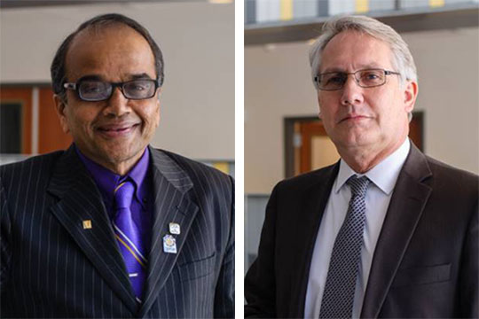 headshots of two men with glasses wearing suits