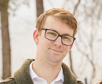 headshot of man with glasses