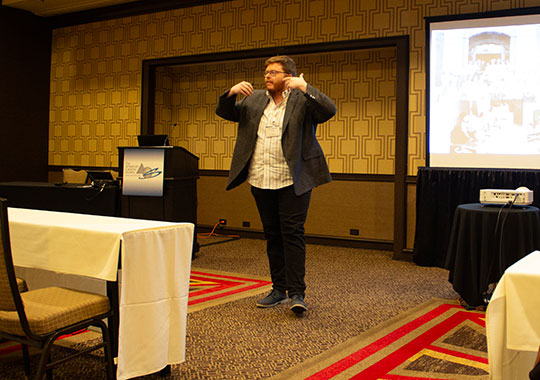  man speaking near podium