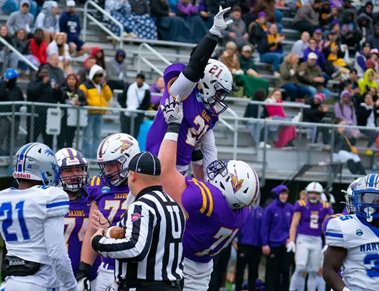 photo of football players celebrating