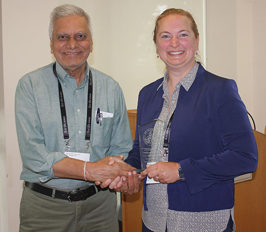 man shaking hands with a woman