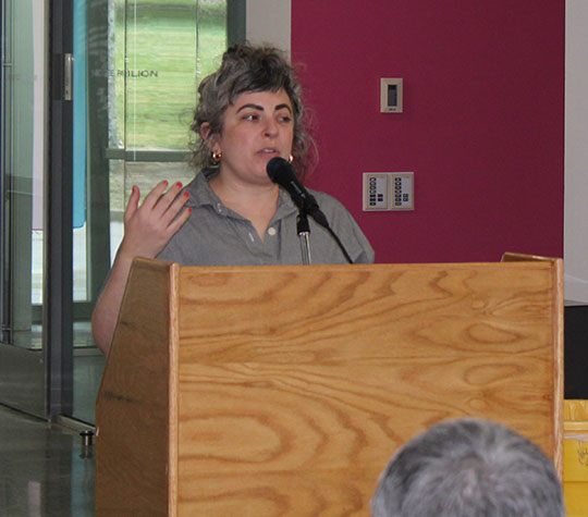 woman speaking at a podium