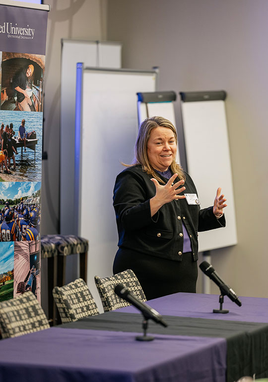 woman at table talking