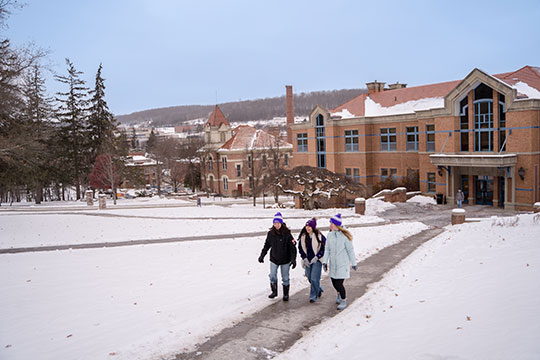 campus image, three students walking