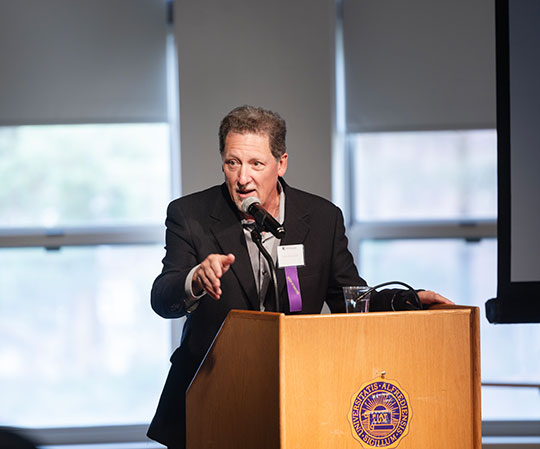 man talking at a podium