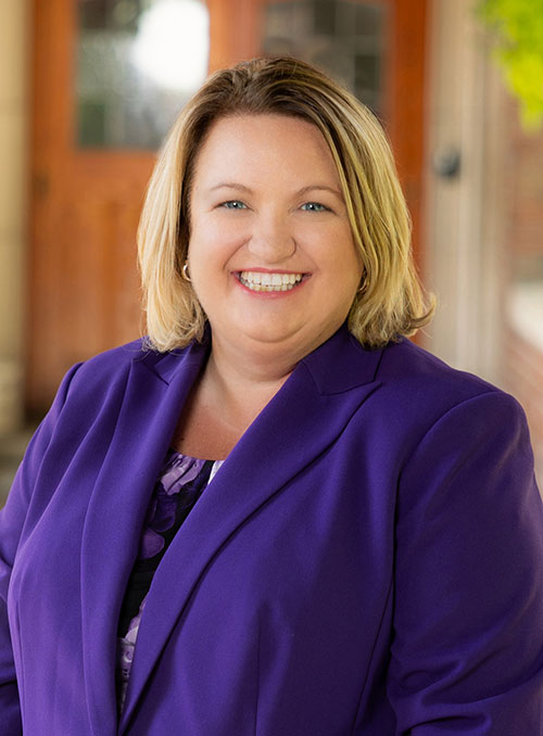 image of Dr. Harvey in a suit, smiling