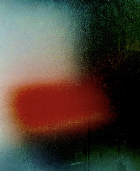 Abstract image with a red, rectangular shape at the center, surrounded by a soft blend of green, blue, and black hues, conveying a moody atmosphere.