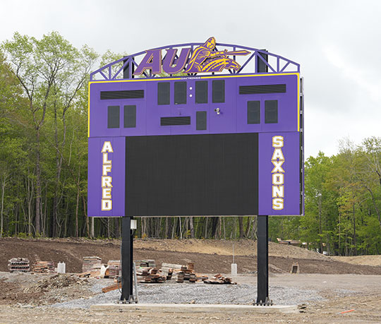 Newly installed purple and gold Alfred University scoreboard at the Saxon Hill Sports Complex construction site.