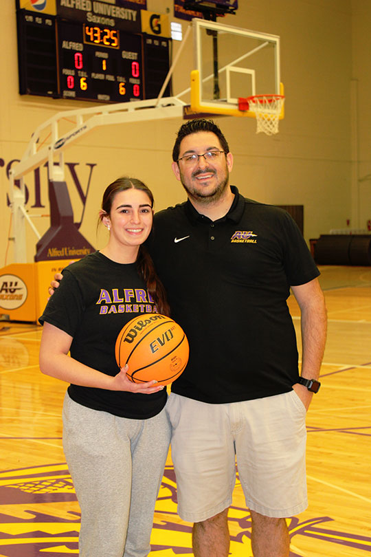 man and woman on basketball court