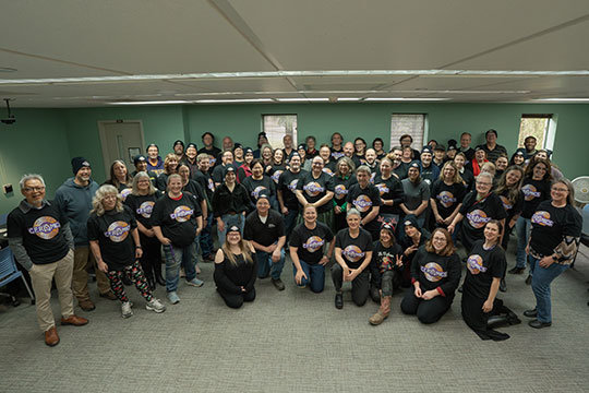 group photo of several people in a room