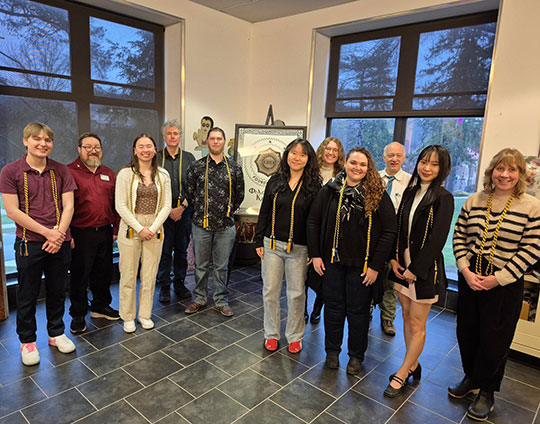 people standing in a line smiling