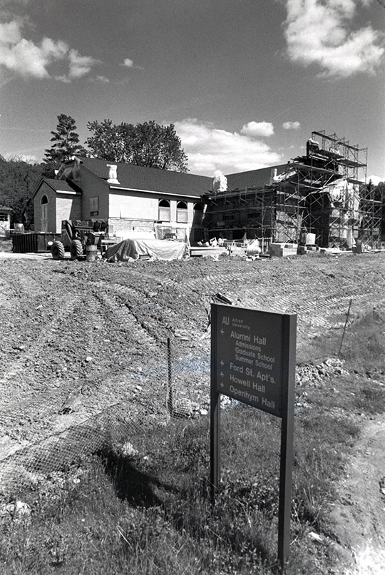black and white photo of building under construction
