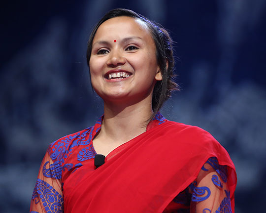 headshot of woman with short dark hair, smiling