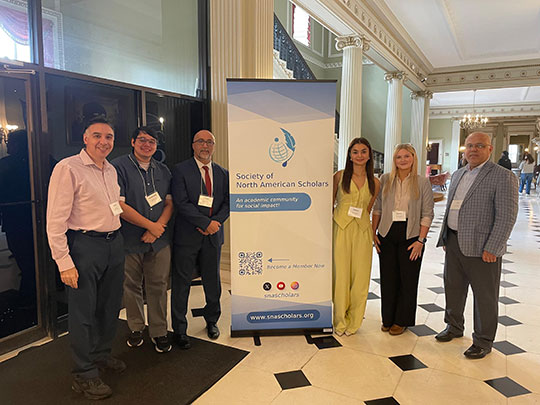 group of six people standing in a row