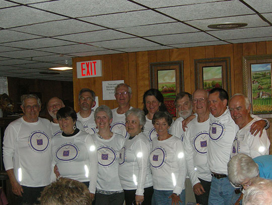 group of people standing in two rows