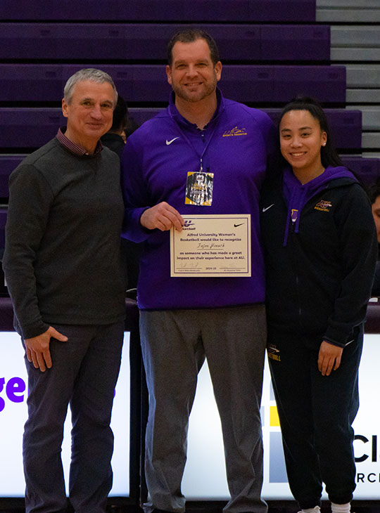 photos of three people, one holding a certificate