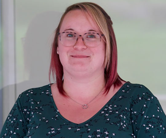 headshot of woman wearing glasses