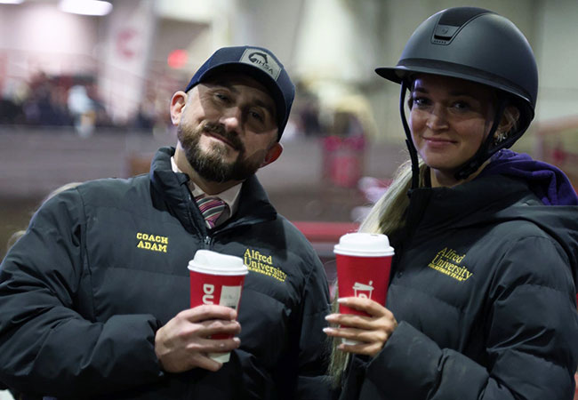 man and woman holding a beverage