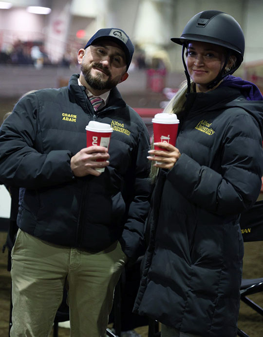 man and woman holding a beverage