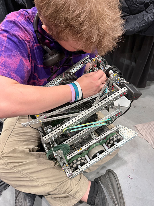 someone working on a robot