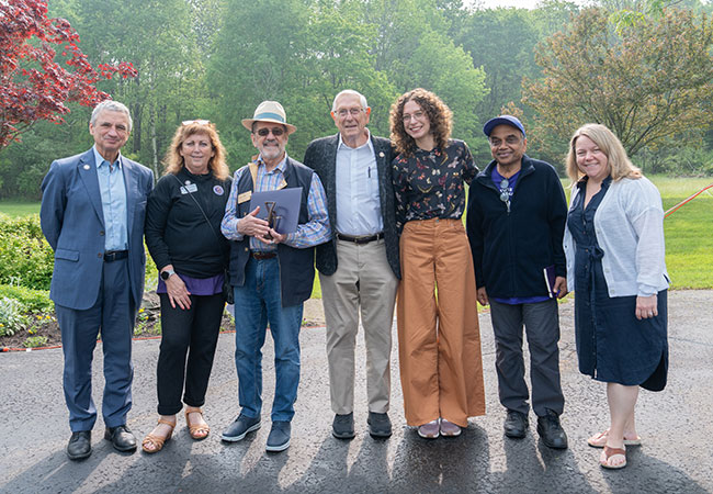 group of several people standing in a row