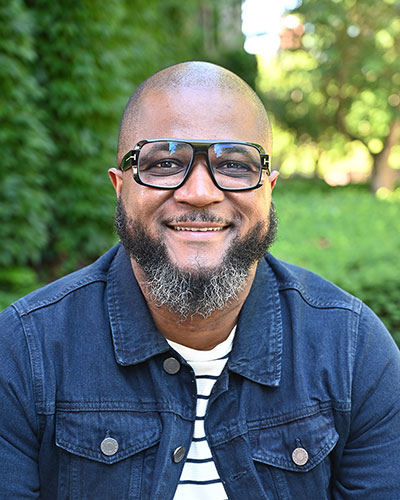 headshot of man wearing glasses